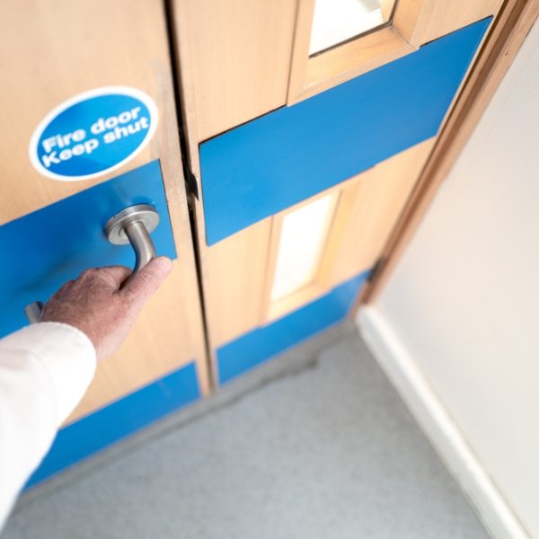 Office,Worker,Seen,About,To,Open,A,Fire,Door,Located